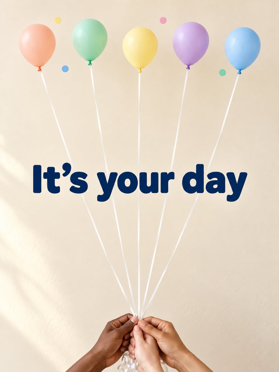 Birthday greeting image: three hands holding the strings of five pastel balloons. It says “It’s your day”