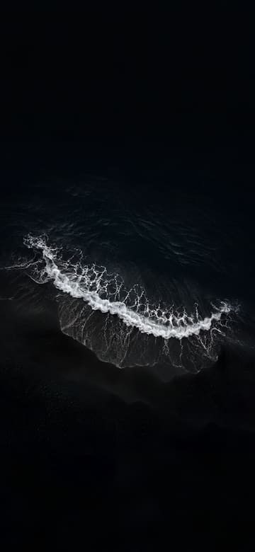 Playa de arena negra desde arriba, fondo de pantalla para teléfono, sin texto